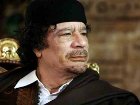Каддафи от греха подальше спрятался в подземном бункере. Но и там ходит в бронежилете и каске