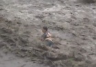В Харькове женщина чуть не утонула в дождевой воде. Видео