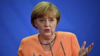 Меркель обвинила Путина в давлении на Украину