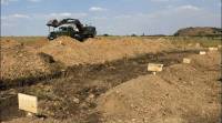 В Донецкой области найдено стихийное кладбище боевиков
