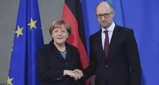 Меркель поблагодарила Арсения Яценюка за «весомый вклад в реформы»